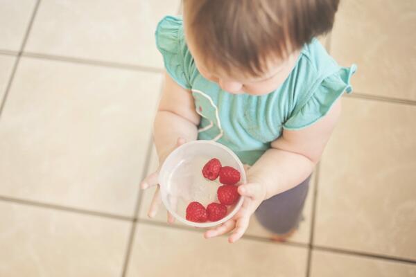 baby eating fruit